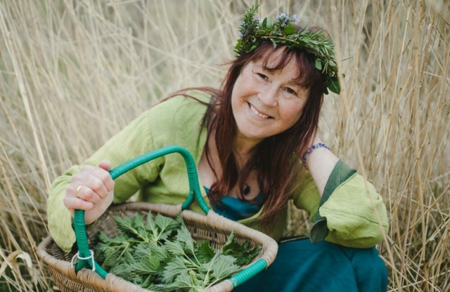 Jules Cooper - Well-known north Wales forager, holding a wicker basket of foraged leaves